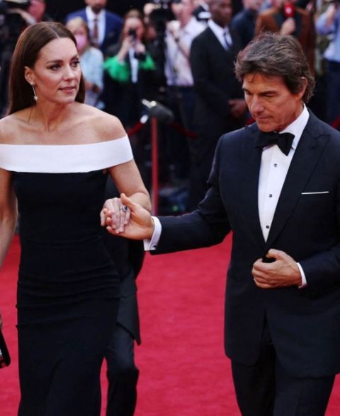 As she walks the red carpet for Top Gun: Maverick, the Duchess of Cambridge holds Tom Cruise's hand.